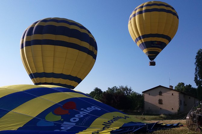 Balloon Ride over Catalonia with optional Pick-up from Barcelona - The landing, balloon packing, and cava toast