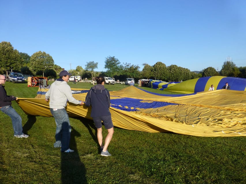 Barcelona: Hot Air Balloon Ride with Optional Transportation - Helping inflate the balloon before takeoff