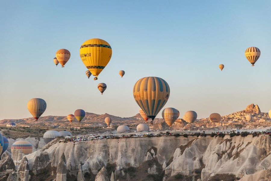 Cappadocia: Panoramic Hot Air Balloon Viewing Tour - Watching Cappadocia wake beneath the balloons