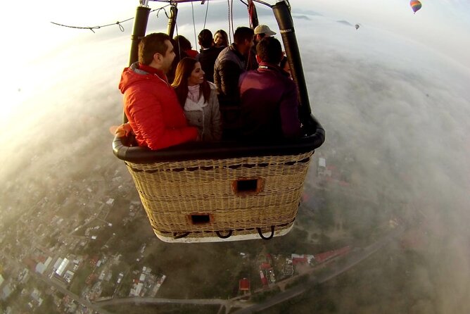 Sunrise HotAir Balloon Adventure Over Teotihuacan's Pyramids - Landing, celebration, and time near the pyramids